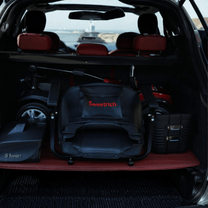 Hopfälld Sweetrich S1 Sport permobil i bilens bagageutrymme